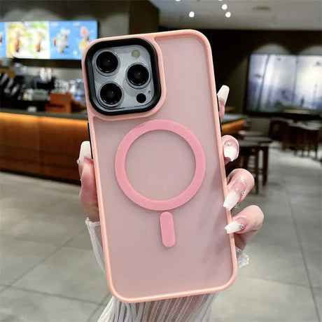 A woman holding a pink phone case with a magni