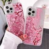 a woman holding a pink phone case with pink flowers