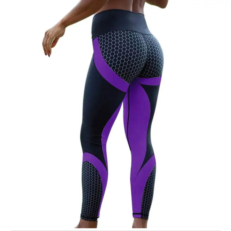 a woman in purple and black workout leggings