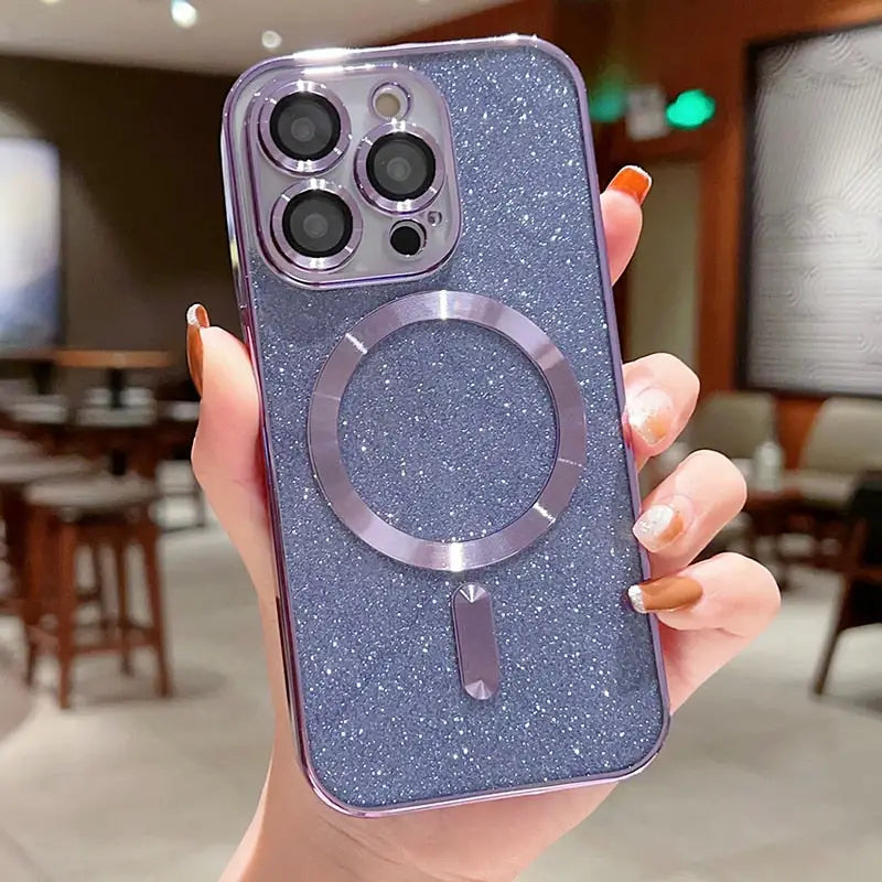 A woman holding up a purple glitter phone case