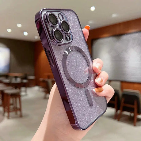 A woman holding a purple glitter phone case