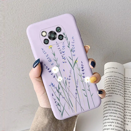 a woman holding a purple phone case with lavender flowers