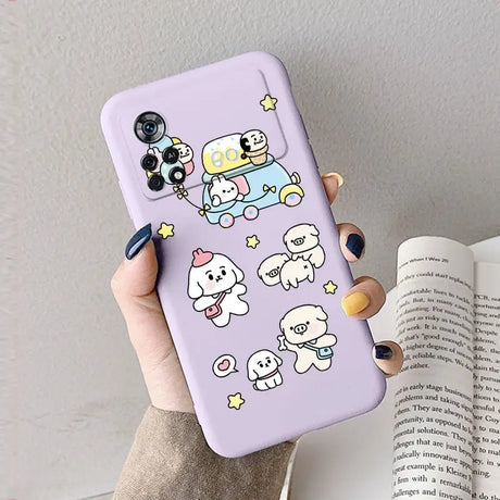 A woman holding a purple phone case with cartoon characters on it