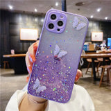 a woman holding up a purple phone case with glitter and butterflies