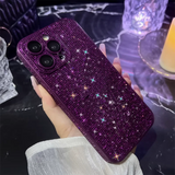 a woman holding a purple phone case with sparkling stars