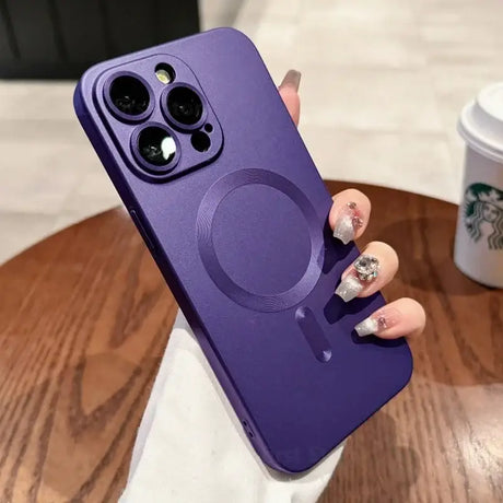 a woman holding a purple phone case