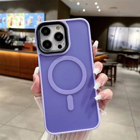 A woman holding a purple phone case with a phone holder