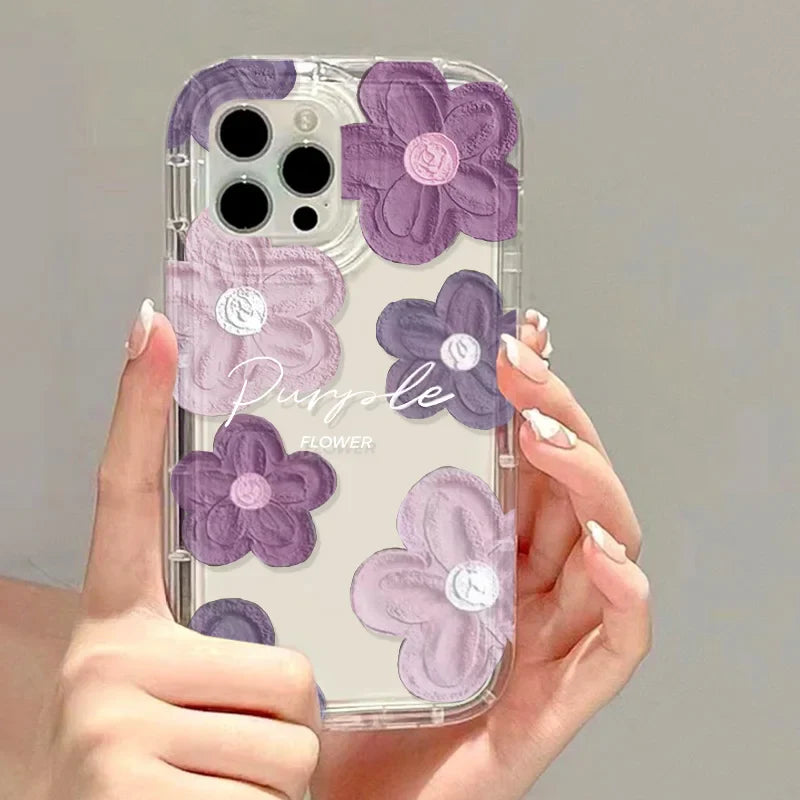 a woman holding a purple and white phone case