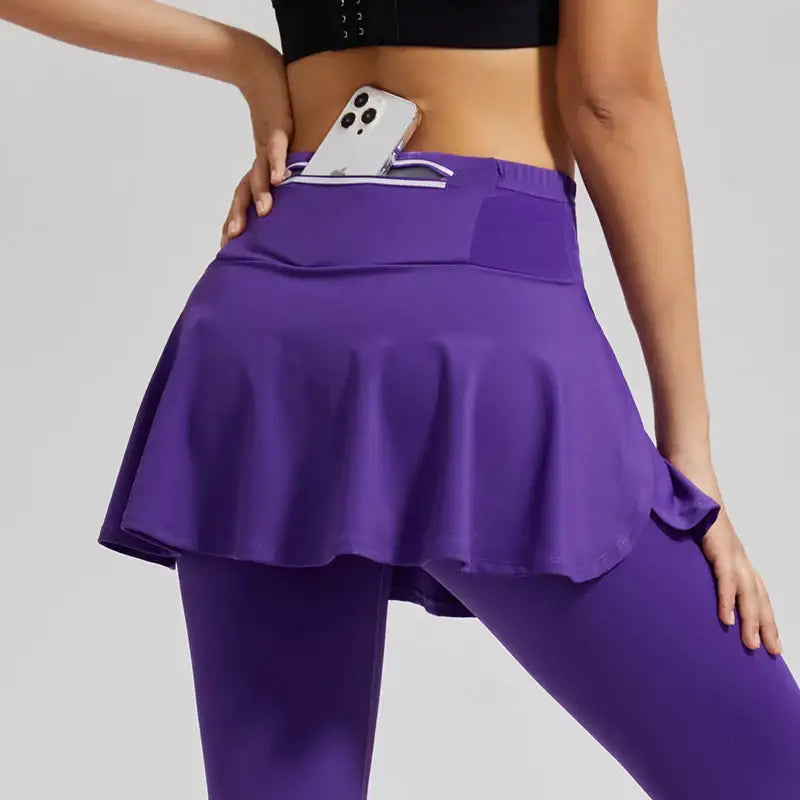 a woman in purple yoga pants and a black top