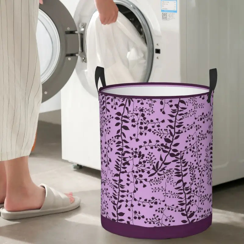 a woman is putting a laundry basket in front of a washing machine