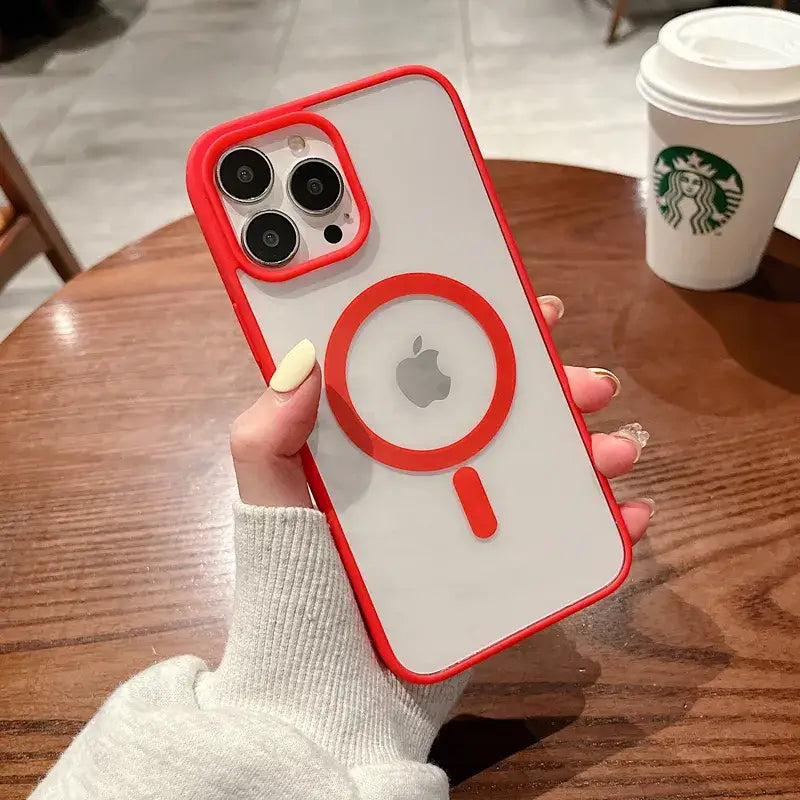 a woman holding a red iphone case with a white phone in the background