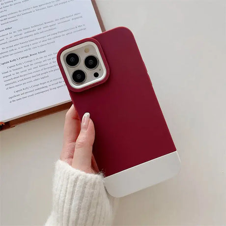 A woman holding a red iphone case