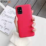A woman holding a red phone case