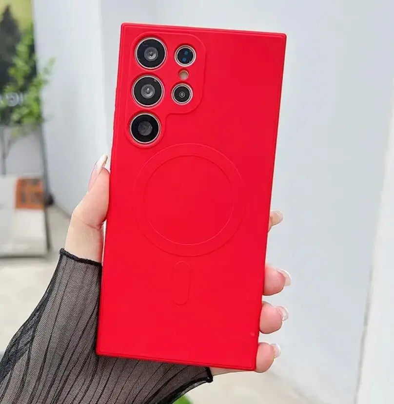 A woman holding a red phone case