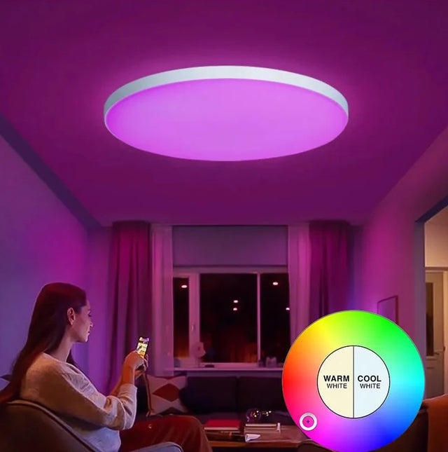 a woman sitting in a living room with a remote control light