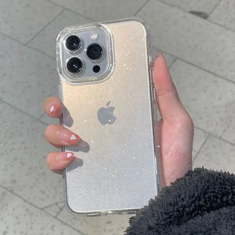 A woman holding a silver iphone case