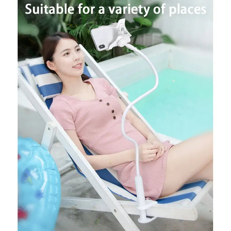 a woman sitting in a chair with a pool in the background