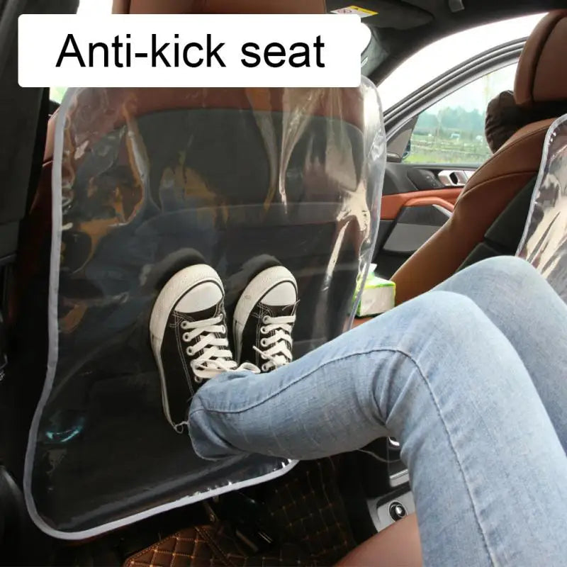 a woman sitting in the back seat of a car with her feet up