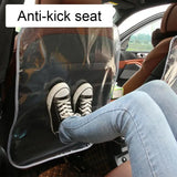 a woman sitting in the back seat of a car with her feet up