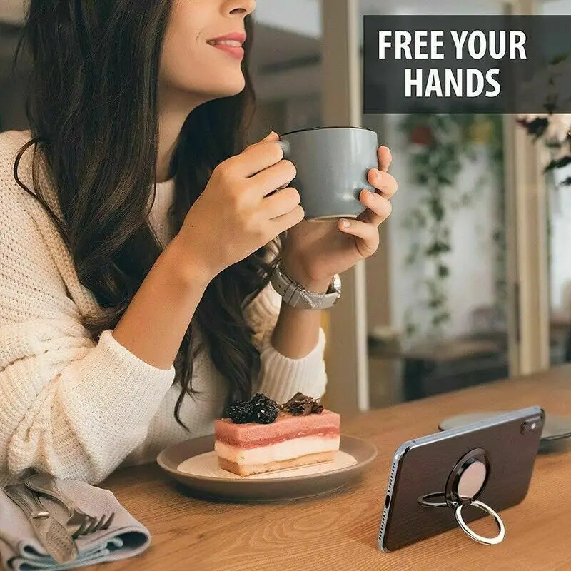 a woman sitting at a table with a cup of coffee and a tablet