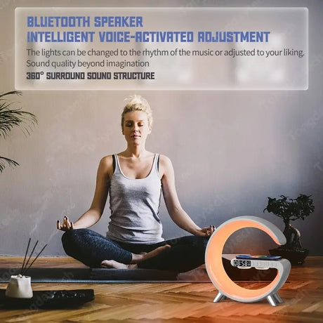 a woman sitting on a wooden floor with a clock