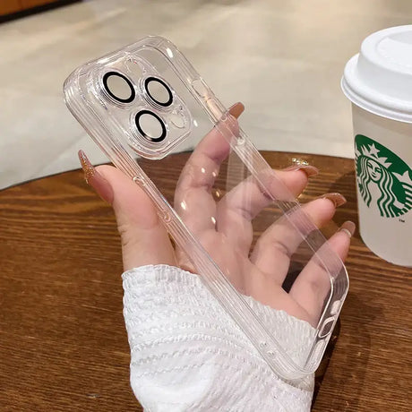 A woman holding a starbucks cup and a phone case