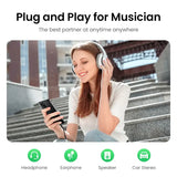 A woman sitting on the steps with headphones on