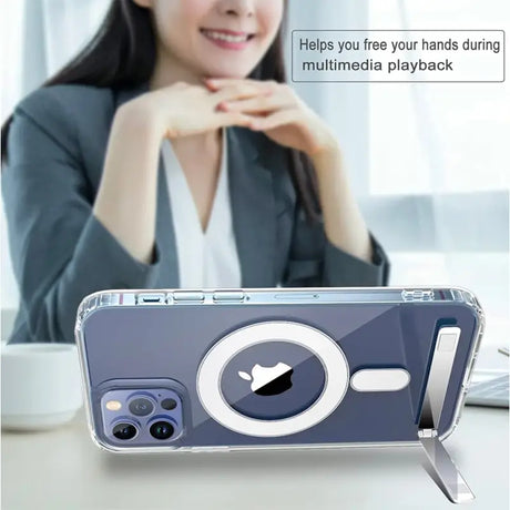 a woman sitting at a table with a cell phone