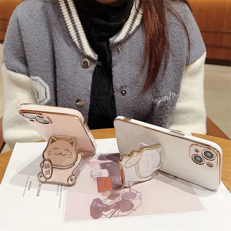 A woman sitting at a table with a phone