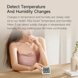 a woman sitting at a table with a therm