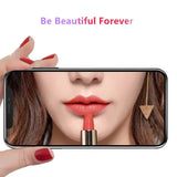 a woman holding a phone with a lipstick on it