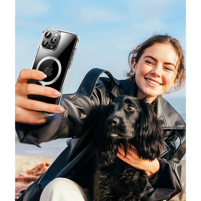 a woman taking a picture of her dog