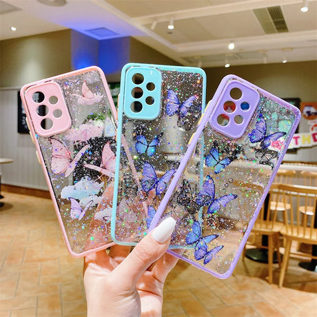 a woman holding up three iphone cases with glitter and glitter