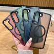 a woman holding up three iphone cases