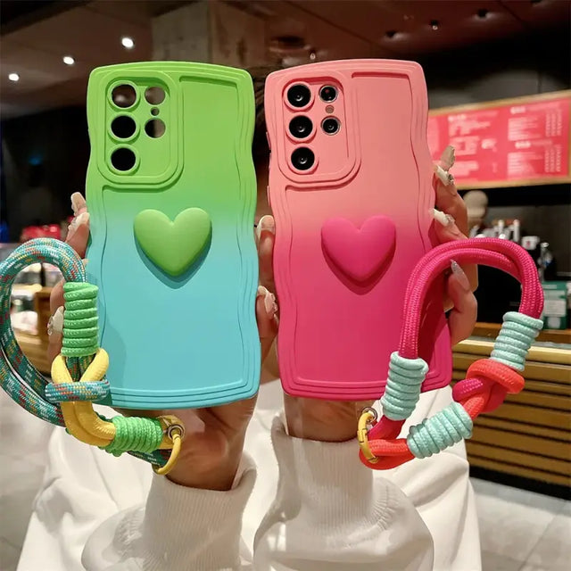 a woman holding two colorful phone cases
