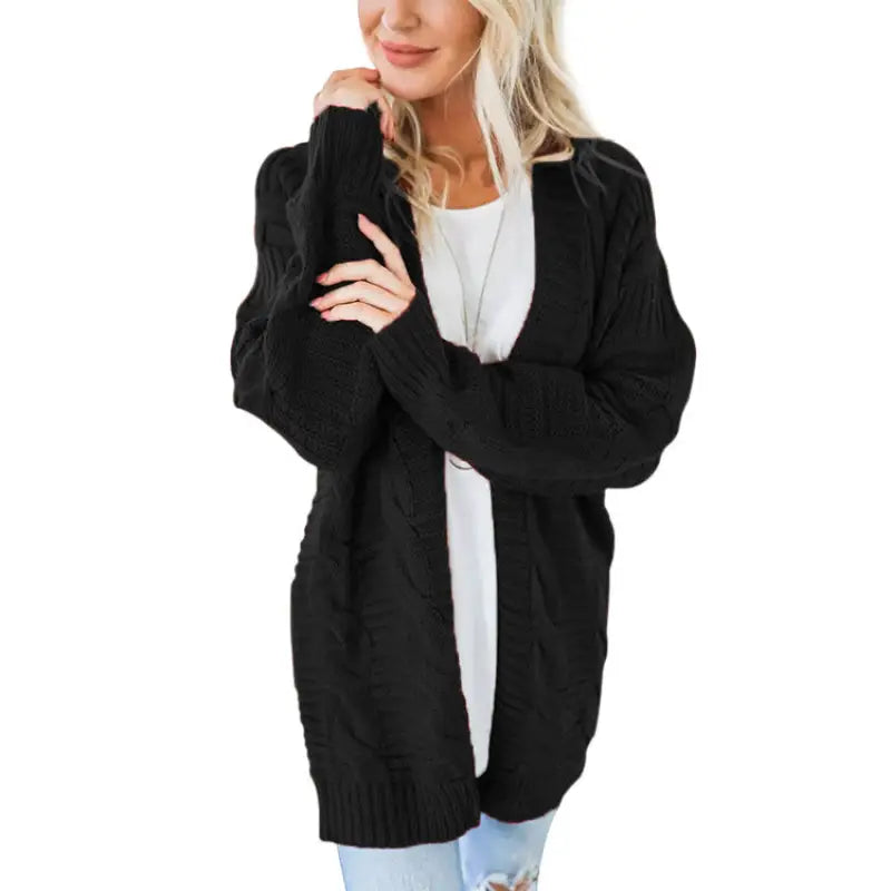 a woman wearing a black cardigan sweater