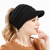 a woman wearing a black knit hat