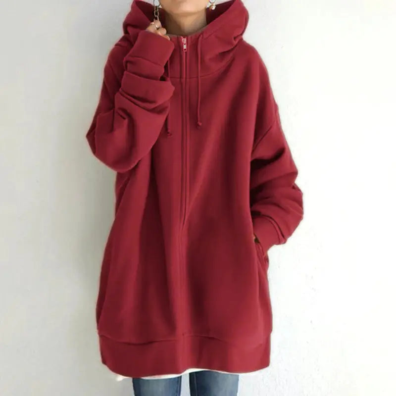 a woman wearing a red hoodie jacket