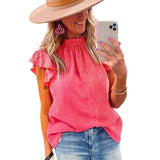 a woman wearing a pink top and jeans