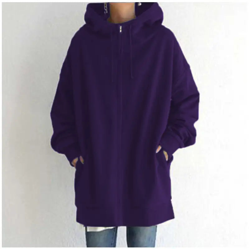 a woman wearing a purple hoodie jacket