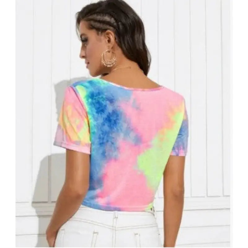 a woman wearing a tie dye t shirt