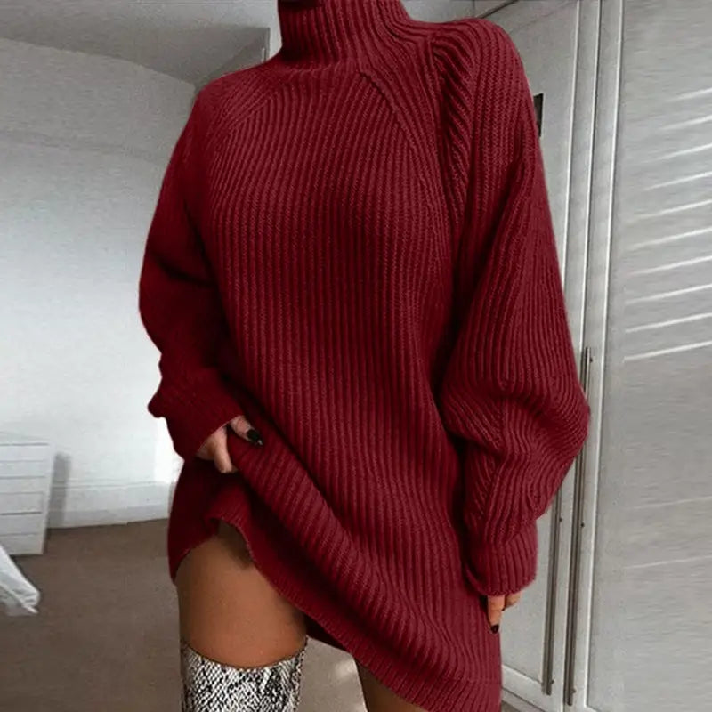 a woman wearing a red sweater and thigh high heel boots