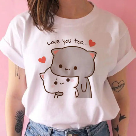 a woman wearing a white t shirt with a cat on it