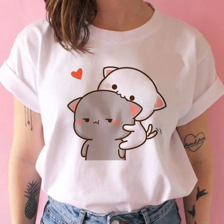 a woman wearing a white t shirt with a cat on it