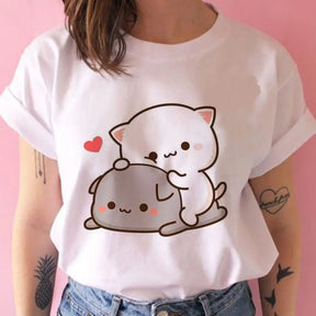 a woman wearing a white t shirt with a bear on it