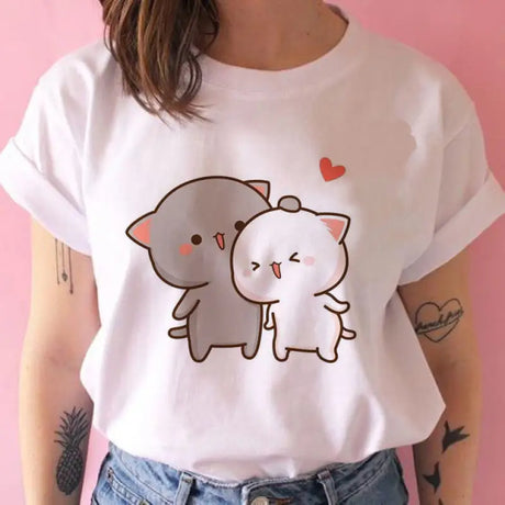 a woman wearing a white shirt with an elephant on it