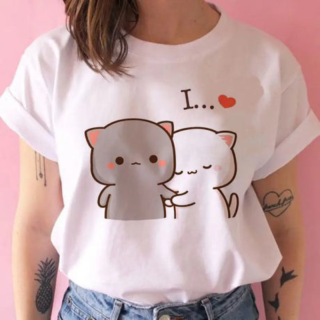 a woman wearing a white t shirt with a cat on it