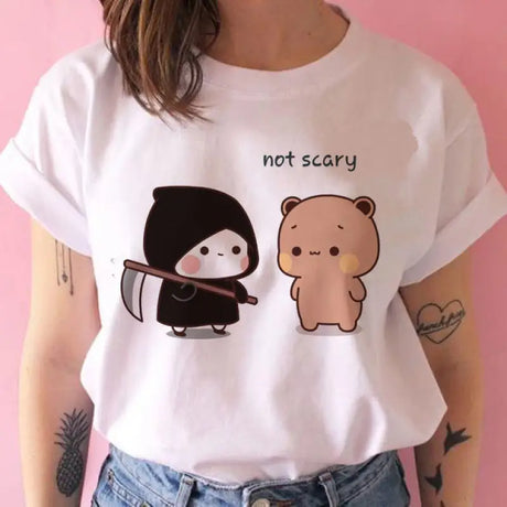 a woman wearing a white t shirt with a bear and bear face on it