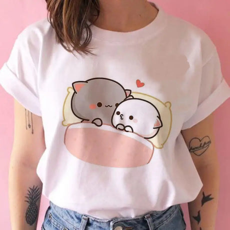 a woman wearing a white shirt with a cartoon cat on it