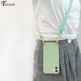 a woman wearing a white shirt and black and white plaid skirt with a green leather phone case